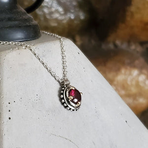 FACETED RHODOLITE GARNET PENDANT IN 14KT GOLD & STERLING SILVER