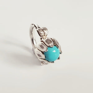 TURQUOISE CABOCHON IN STERLING SILVER PETALS