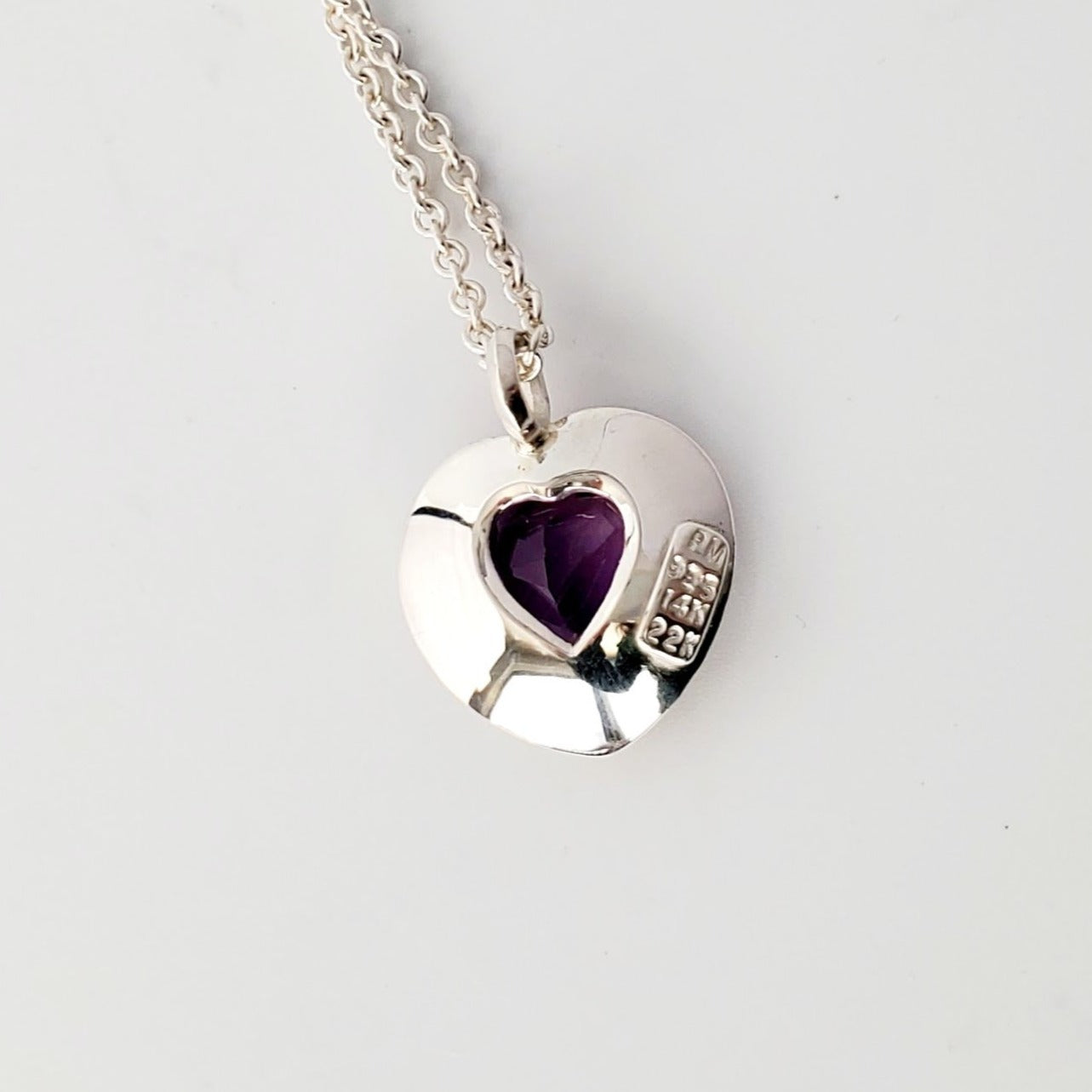 FACETED AMETHYST HEART WITHIN HEARTS OF 14KT, 22kt & STERLING SILVER